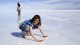 Giulia_on_wet_Salar_de_Uyuni_Bolivia_Luca_Galuzzi_2006